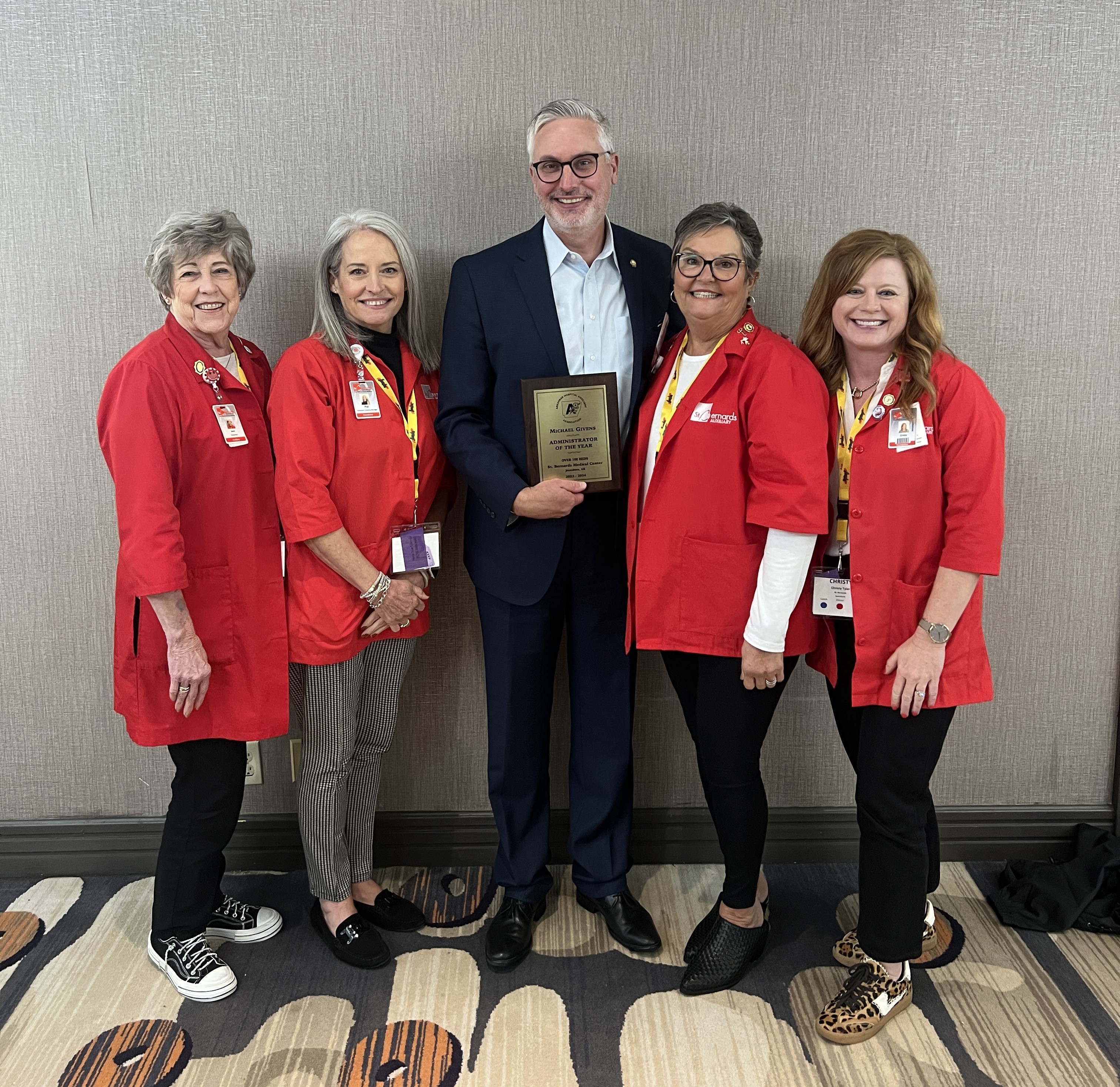 St. Bernards Medical Center Administrator Michael Givens (center) recently received the Arkansas Hospital Association's Administrator of the Year Award for hospitals with more than 100 beds. St. Bernards Medical Center Auxiliary volunteers, including (left to right) Jane Orndorff, Pat Farmer, Rebecca Starks and Cristy Tyler, led the nomination process, culminating with Givens receiving the award at the Hospital Association's annual meeting in Little Rock on November 1.