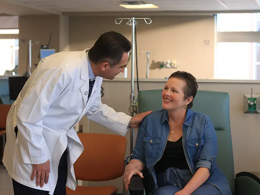 Dr. Khalil with patient in infusion center