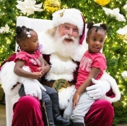 Two children with Santa