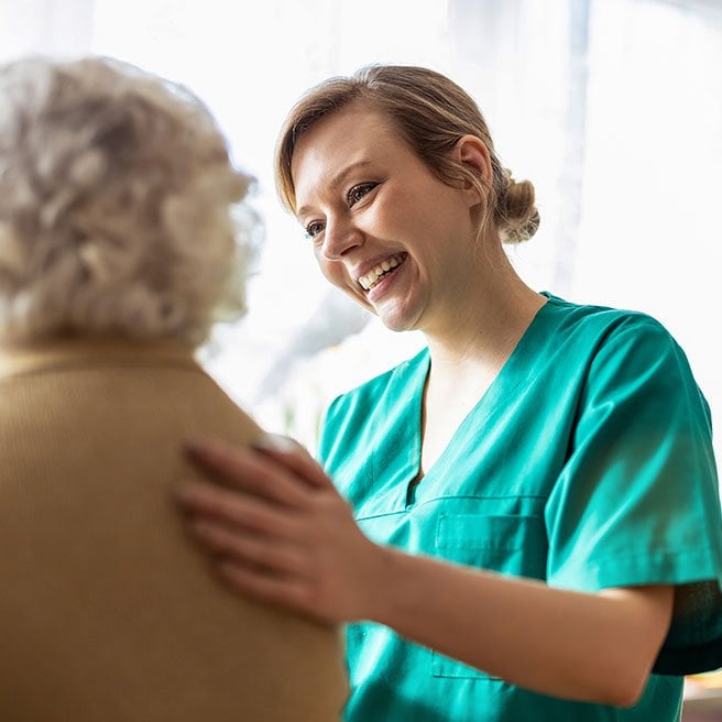 image of doctor smiling with a patient