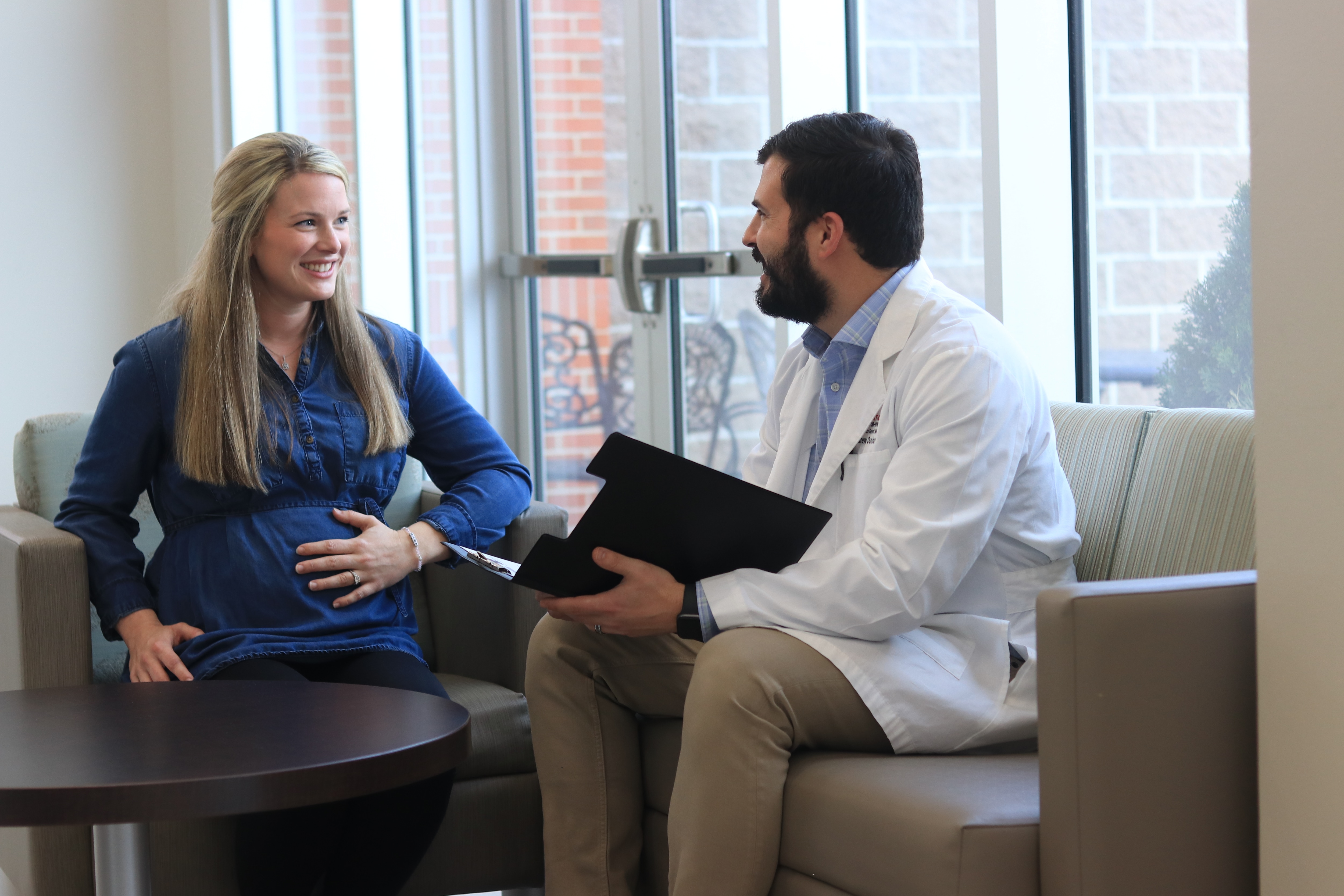 Dr. Dunham with OB patient, smiling 