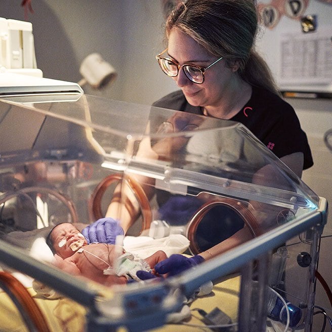 Image of pediatric nurse and newborn baby