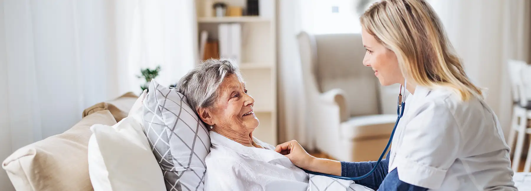 Adobe stock photo nurse with patient in home