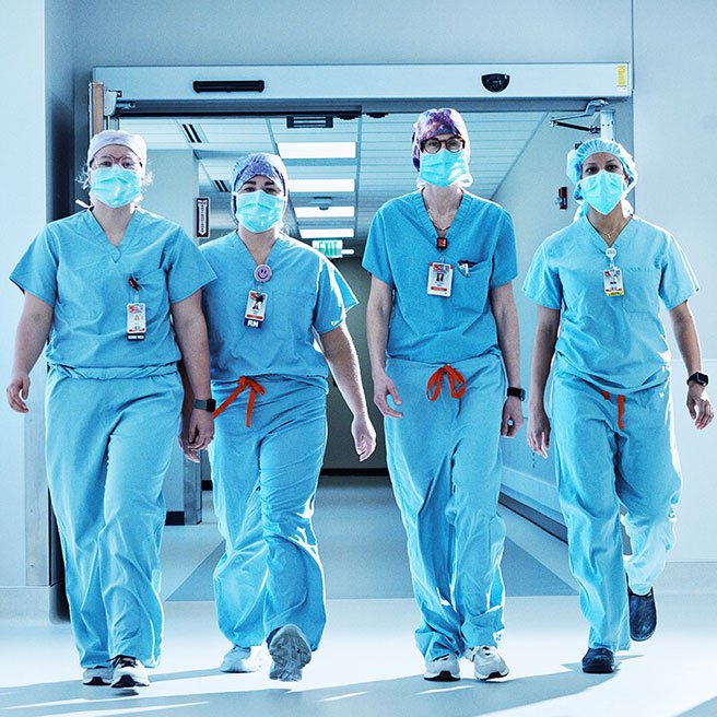 image of surgeons walking down a hallway