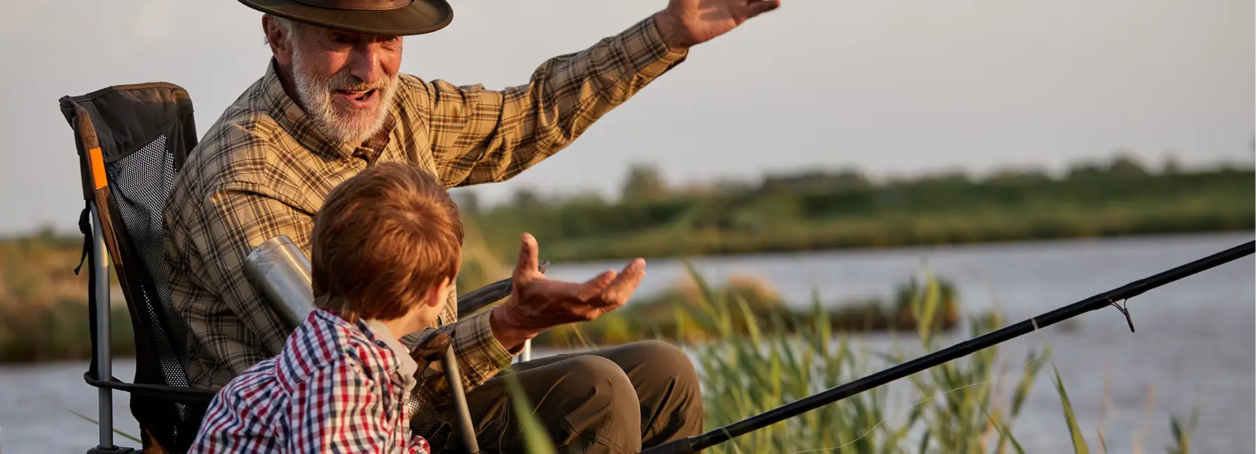 stock photo of grandfather fishing with little boy