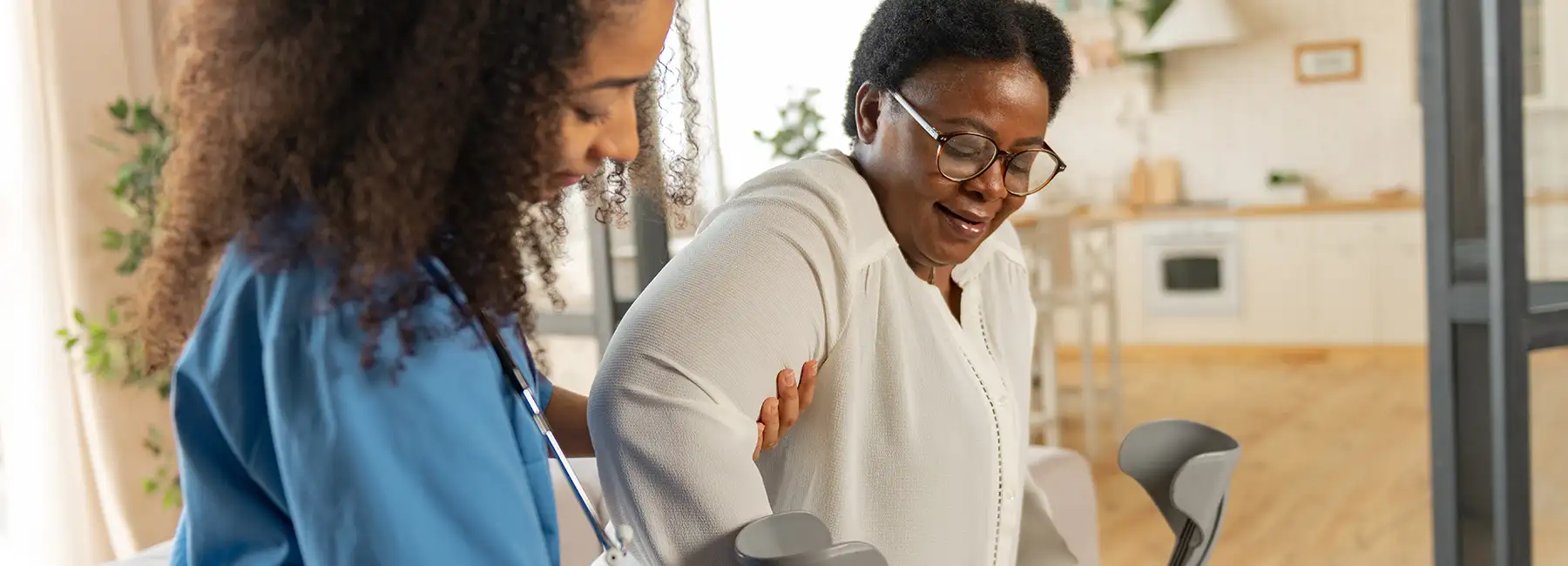 Adobe Stock Photo of Black Home Health Nurse with black senior Patient