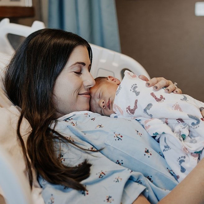 Image of mother and baby in hospital bed