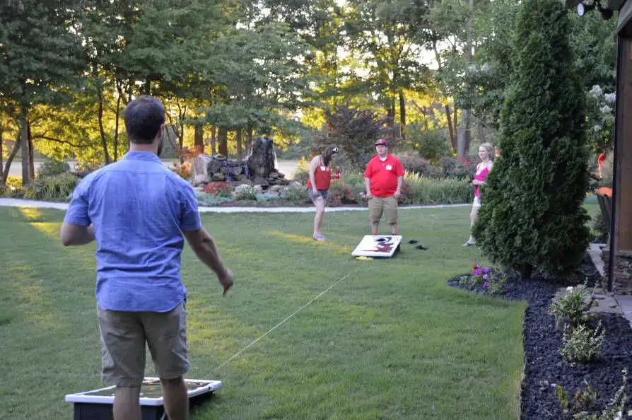 Residents playing Cornhole game at Stan Jones Lodge