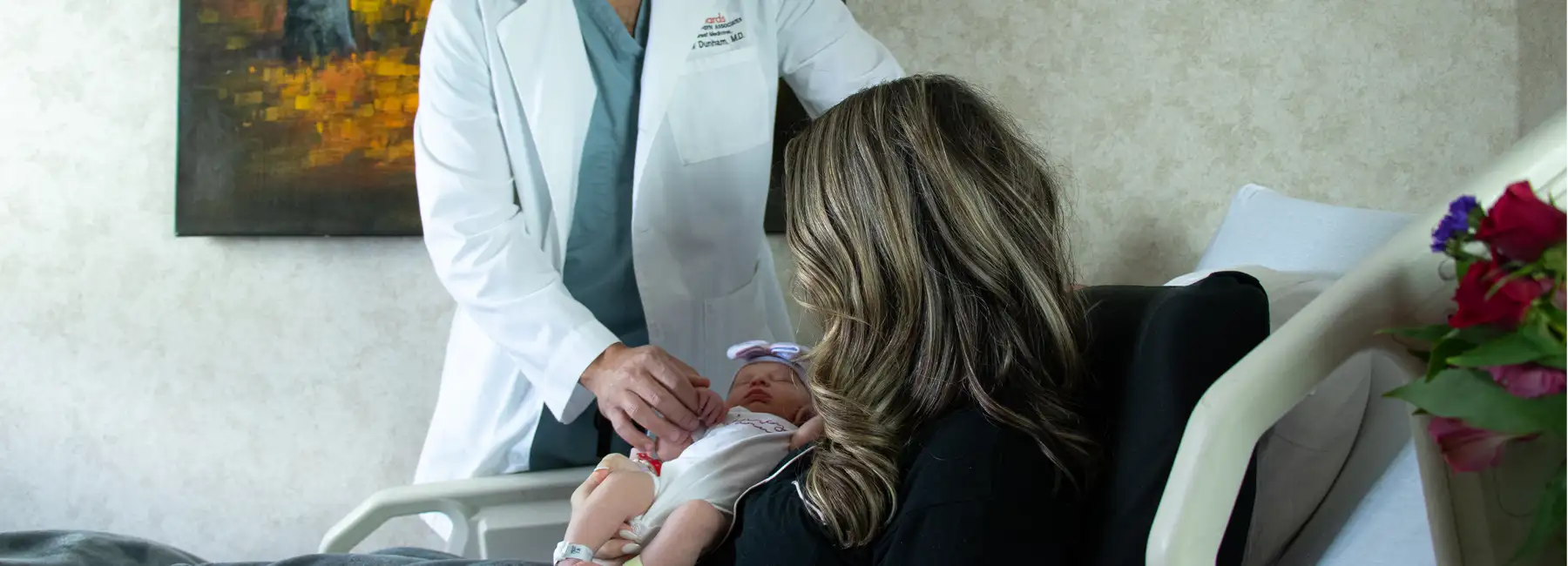 Dr. Dunham with patient and baby