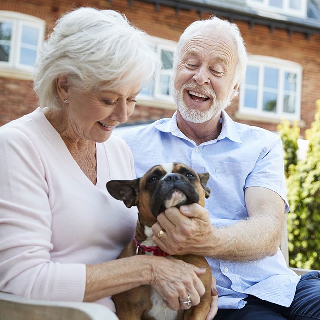 Image of elderly couple with dog