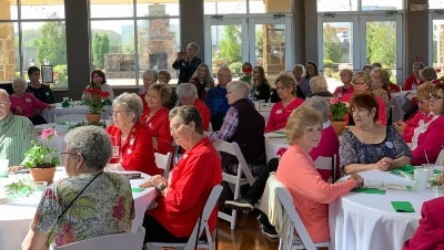 Auxiliary meeting, attendees sitting at tables