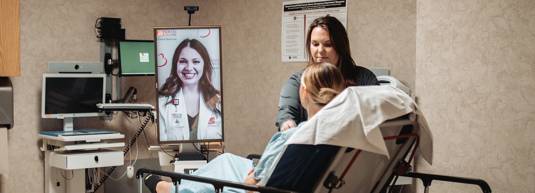 Nurse with patient in room - virtual nursing