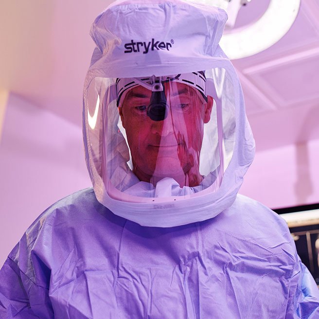 Image of orthopedic surgeon in surgical suite